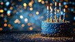 © Multiverse - A blue birthday cake with lit candles, surrounded by a bokeh effect of warm lights