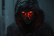 © Vovmar - Dark portrait of a man in a hood with glowing eyes. Generated by artificial intelligence