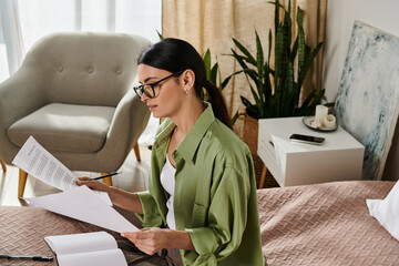 Wall Mural - Woman in casual attire reads a paper on a bed.