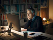 © StockPhotoPro - Man working late at night with his computer