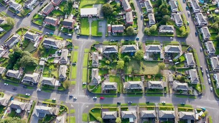 Wall Mural - Aerial drone footage of the British town of Meanwood in Leeds West Yorkshire showing typical UK housing estates and rows of houses from above in the spring time on a sunny day