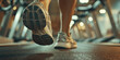 © vefimov - A person running on a treadmill, focusing on exercise and fitness
