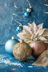 Wall Mural - Three Christmas ornaments, two of which are blue and one is gold