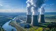 © Александр Марченко - Aerial view of a nuclear power plant with cooling towers emitting steam.