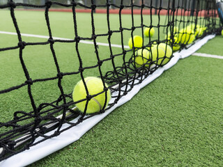 Wall Mural - rackets and paddle balls on a court ready to play