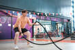 © ijeab - An overweight man is holding a rope and appears to be exercising