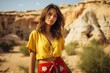 © MediaRaw - A woman in a yellow shirt
