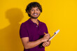 © deagreez - Photo portrait of attractive young man write documents dressed stylish violet clothes isolated on yellow color background