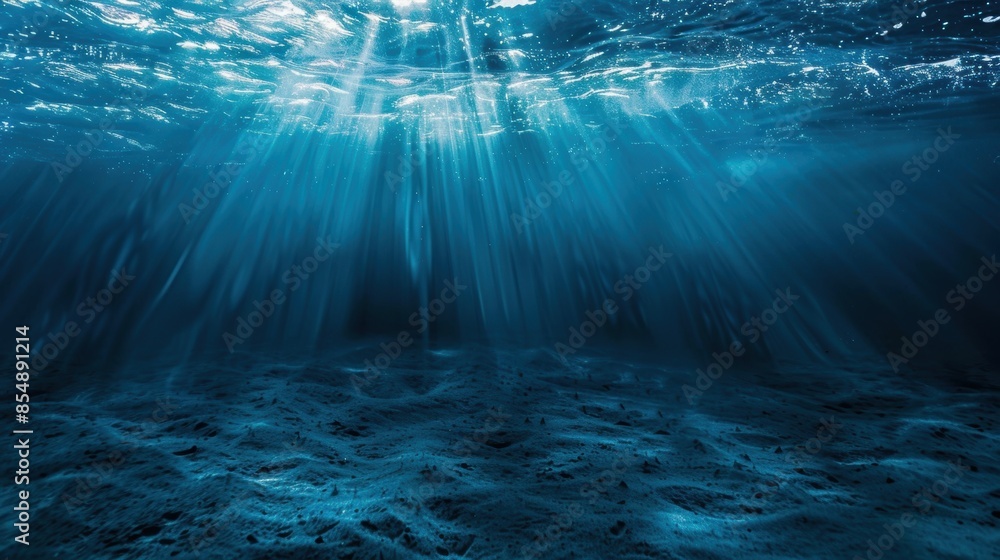 Underwater view of sunlight beams illuminating ocean floor Stock Photo ...