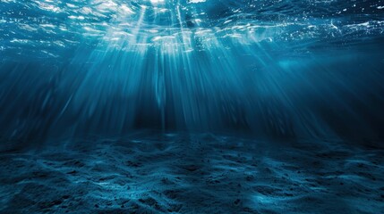 Underwater view of sunlight beams illuminating ocean floor