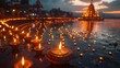 © Prasong Takham - Illuminated Diya Lamps Along River at Sunset Beside Hindu Temple