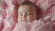 © Farid - Cute Caucasian newborn infant baby girl asleep wrapped in a soft pink plaid. Adorable newborn baby girl portrait studio stock image