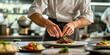 © icecreamparadice - A professional chef meticulously plating a gourmet dish in a high-end restaurant kitchen