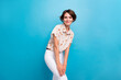 © deagreez - Photo of adorable satisfied shy person hands touch leg posing isolated on bright blue color background