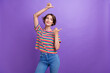 © deagreez - Portrait of charming young lady promoter direct fingers blank space ad ads wear casual clothes isolated purple color background