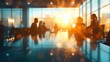 © horizon - Blurred background of business people in an office meeting room with a bokeh effect and sunlight, creating an abstract or blurry stock photo template for various commercial uses.