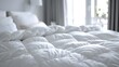© horizon - White duvet on bed in bedroom, closeup. Soft and comfortable texture of fluffy white quilt with empty space. Close up view of hotel room interior design in the style of macro shot.