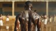 © Multiverse - A shirtless, muscular man stands in a crowd facing away from the camera with his back turned. Covered in dirt, he stands in a large outdoor field