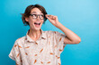 © deagreez - Photo of impressed positive girl arm touch glasses look empty space advert isolated on blue color background