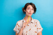 © deagreez - Photo of creative pensive lady hold pencil touch chin look interested empty space isolated on blue color background