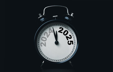 Wall Mural - 2024 and 2025 on black alarm clock on dark background with copy space for preparation of merry chris