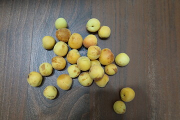 Fresh yellow orange apricots scattered around in a nice pattern