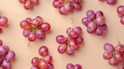 Wall Mural - Red grapes on pastel background, top view. Fresh fruit pattern concept