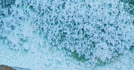 Sticker - Beautiful Sea Beach in summer season,Waves crashing on sandy shore, White clouds and blue sky footage from drone,High angle view nature background