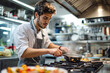 © Mihai Zaharia - Young Male Chef Cooking in Modern Kitchen