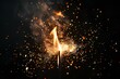 © Nadezhda - A close up of a lit sparkler on a black background