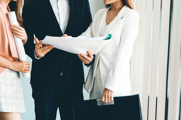 Wall Mural - Businessman is in meeting discussion with colleague businesswomen in modern workplace office. People corporate business team concept. uds