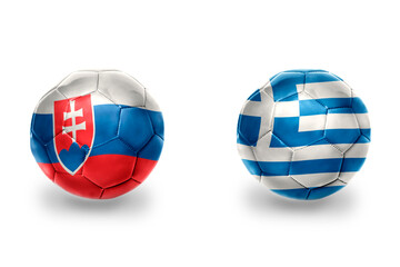 football balls with national flags of greece and slovakia ,soccer teams. on the white background.