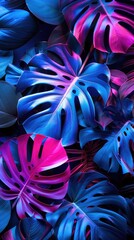 Colorful tropical leaves with vibrant neon lighting.

