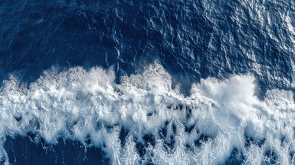 Wall Mural - aerial top view background photo of ocean sea water white wave splashing in the deep sea