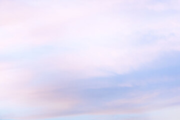 Wall Mural - Sky with soft and fluffy pastel orange pink and blue colored clouds. Sunset background. Nature. sunrise.