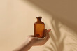 © photoguns - Woman's hand holding premium amber glass bottle ideal for skincare products. Generative AI