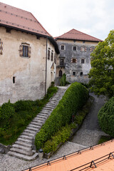 Wall Mural - Panoramic view from Lake Bled, beauty heritage in Slovenia. Island with church and castle in the background create a dream setting. View from the castle, museum and court.