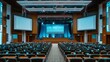 © Emiliia - A wide shot of an empty auditorium with rows of seats facing a stage with a large screen.