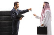 © Ljupco Smokovski - Auto mechanic giving car keys to a saudi arab man