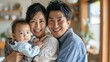 © The Little Hut - A Japanese family of four standing in the dining room with smiles on their faces Father mother cuddled toddler and newborn baby looking at the camera : Generative AI