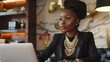 © Bijac - sophisticated black woman in an expensive suit and jewelry in her luxury home office lifestyle portrait