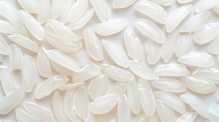 Polished white rice grains neatly arranged on white background texture