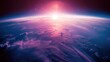 © Jiraporn - A stunning view of Earth's curvature from space with a vibrant sunrise and cloud formations.