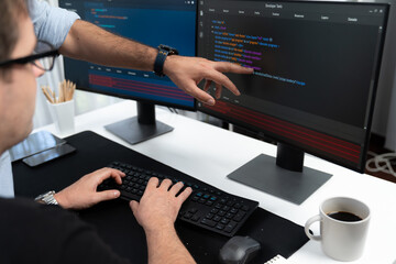 it developers creating online software development information on screen laptop with coding program 