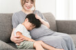 © buritora - 妊婦のお母さんのお腹の上でお昼寝をする男の子の寝顔（お昼寝・寝かしつけ・眠い・子守唄）