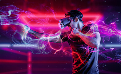 Wall Mural - Man wearing VR glass and smashing or punching at camera in neon boxing arena. Sport gamer boxing and moving gesture in metaverse or virtual world while using digital technology innovation. Deviation.