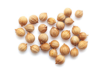 Wall Mural - Close-up of Dried Coriander (Coriandrum sativum) seeds isolated on white background. Top view.