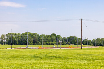 Wall Mural - Country landscape with a railroad on a field