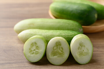 Wall Mural - Sliced cucumber on wooden background, Organic vegetable, Food ingredient