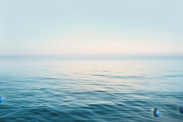 Wall Mural - A wide expanse of water under a sky background with soft gradient hues of blue, A soft gradient of light blue tones blending seamlessly